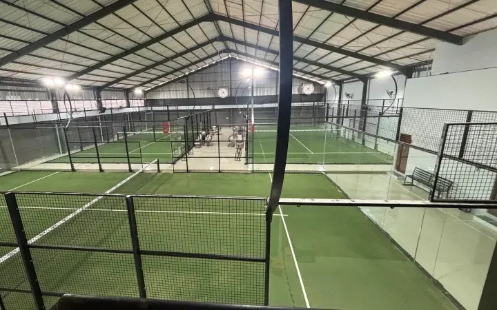 Courts under the gabled steel roof