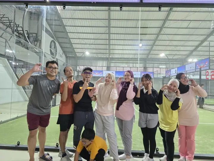 A group of players posing on court